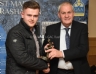 Aodhan Hardy recieves the Reserve Footballer of the Year Award from Reserve Manager Cathal Cowan.